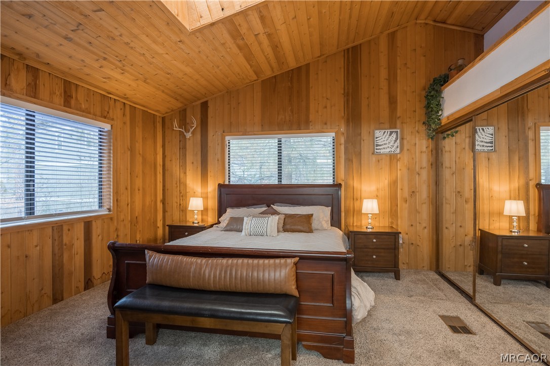 42324 Paramount Road Big Bear Lake, CA 92315 - Photo 15 of 50 a bedroom with a bed and wooden floor
