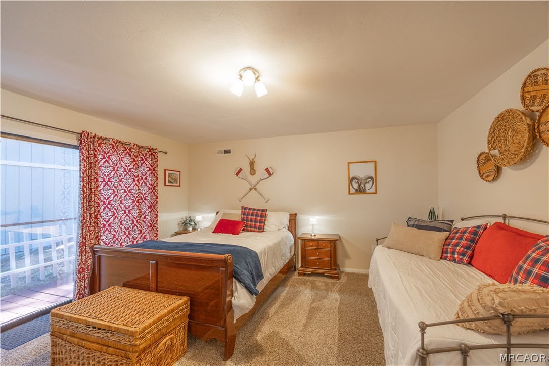 42324 Paramount Road Big Bear Lake, CA 92315 - Photo 19 of 50 a bedroom with a bed and dresser