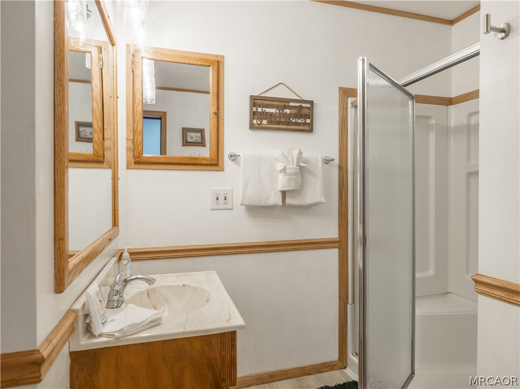 42324 Paramount Road Big Bear Lake, CA 92315 - Photo 22 of 50 a bathroom with a sink and a mirror