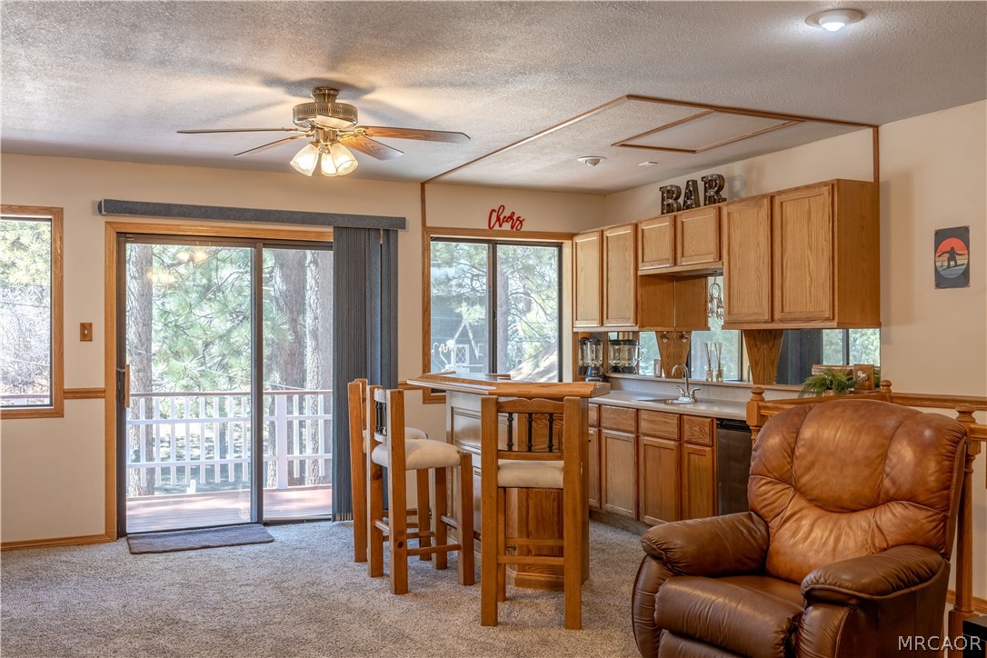 42324 Paramount Road Big Bear Lake, CA 92315 - Photo 24 of 50 a living room with furniture a ceiling fan and a window