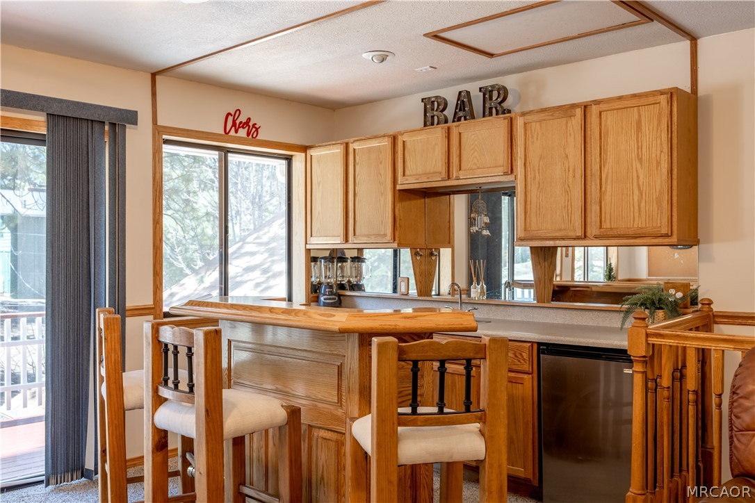 42324 Paramount Road Big Bear Lake, CA 92315 - Photo 28 of 50 a kitchen with stainless steel appliances a sink and a window