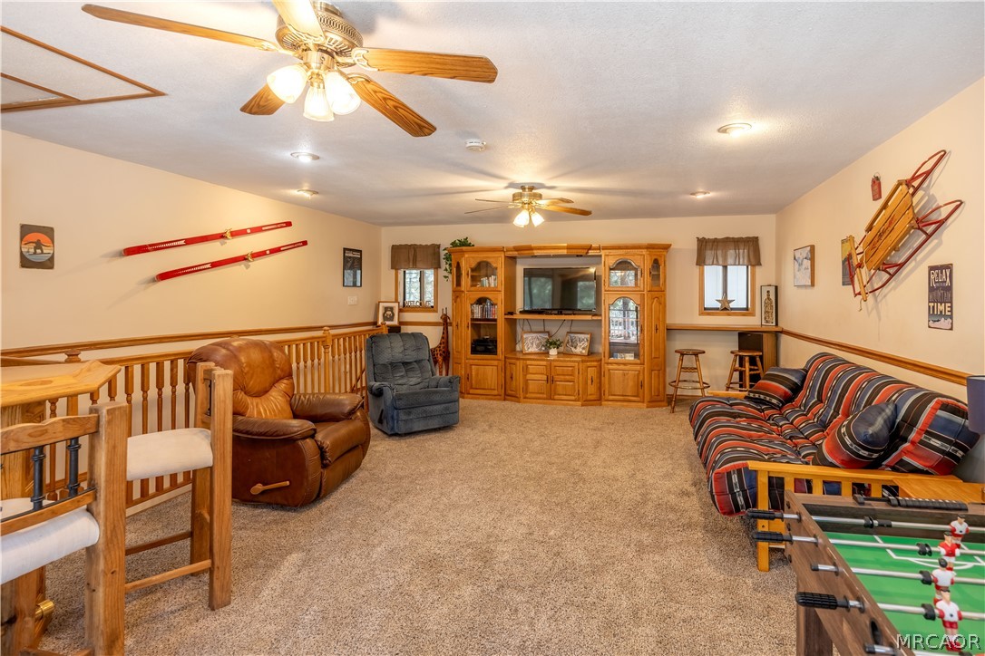 42324 Paramount Road Big Bear Lake, CA 92315 - Photo 30 of 50 a living room with furniture and flat screen tv