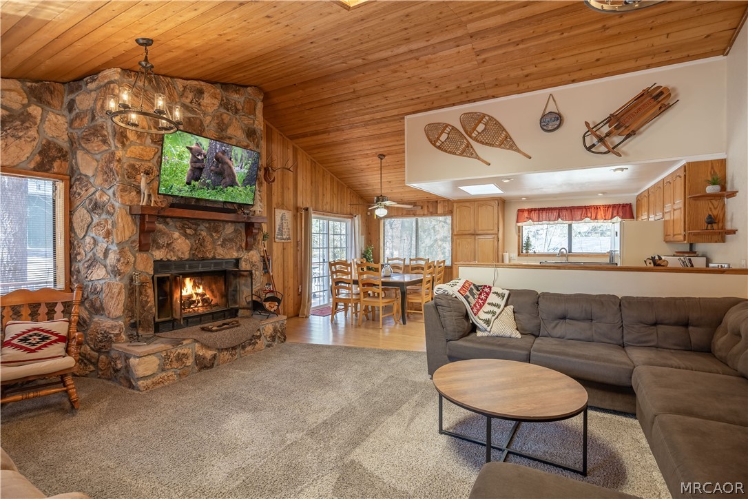 42324 Paramount Road Big Bear Lake, CA 92315 - Photo 8 of 50 a living room with furniture and a fireplace
