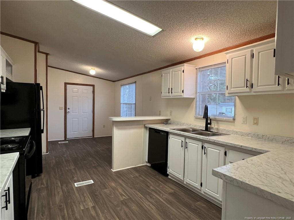 175 Travis Drive Cameron, NC 28326 - Photo 14 of 25 a kitchen with a sink stove and refrigerator