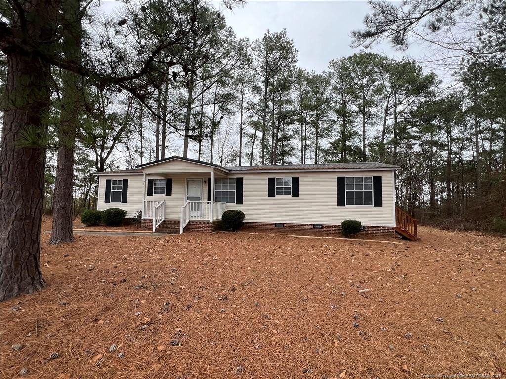 175 Travis Drive Cameron, NC 28326 - Photo 21 of 25 a view of a house with a yard