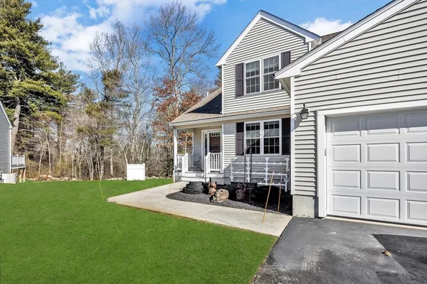 a front view of a house with a garden and porch
