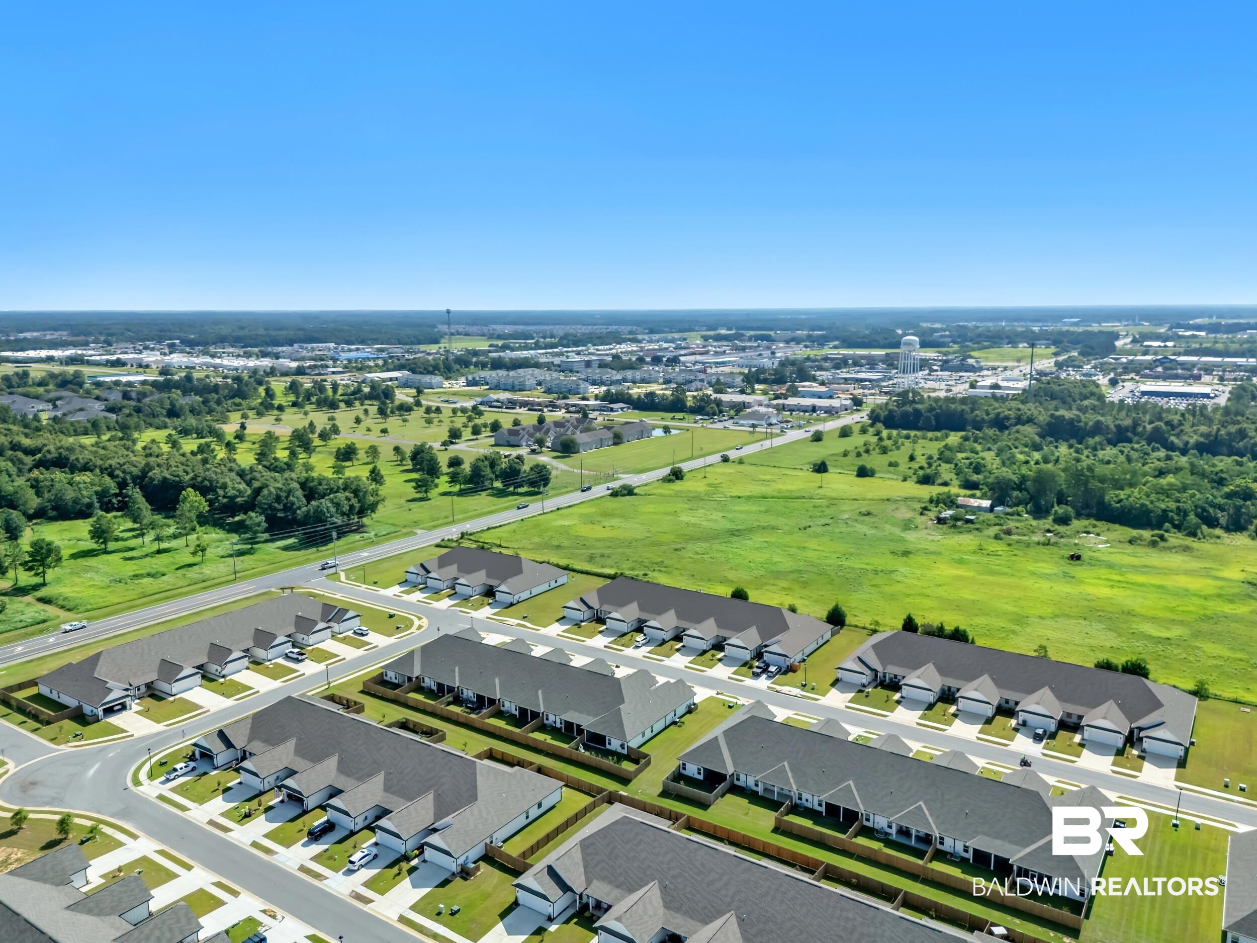 9933 Weller Cove Foley, AL 36535 - Photo 35 of 36 Aerial perspective of a developed residential community featuring multiple single-story homes with dark roofs and light-colored siding