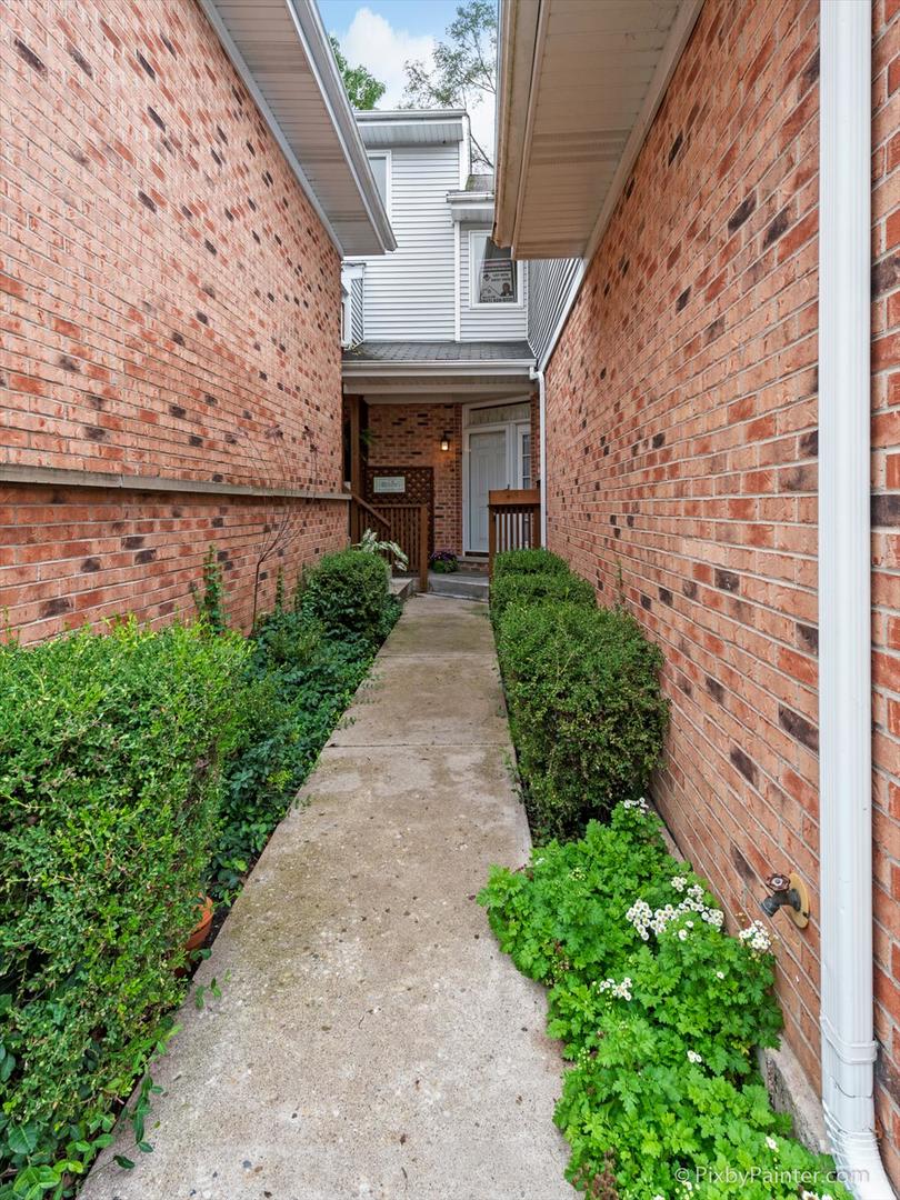 254 Charlotte Court Cary, IL 60013 - Photo 3 of 30 a front view of a house with a garden