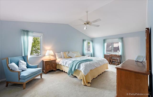 254 Charlotte Court Cary, IL 60013 - Photo 22 of 30 a bedroom with a bed couch and window