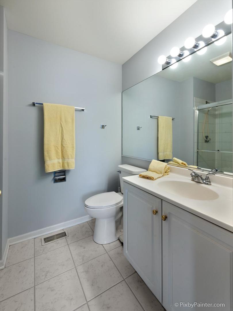 254 Charlotte Court Cary, IL 60013 - Photo 23 of 30 a bathroom with a sink mirror and toilet