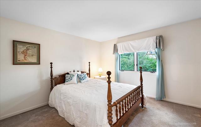 254 Charlotte Court Cary, IL 60013 - Photo 25 of 30 a bed sitting in a bedroom next to a window