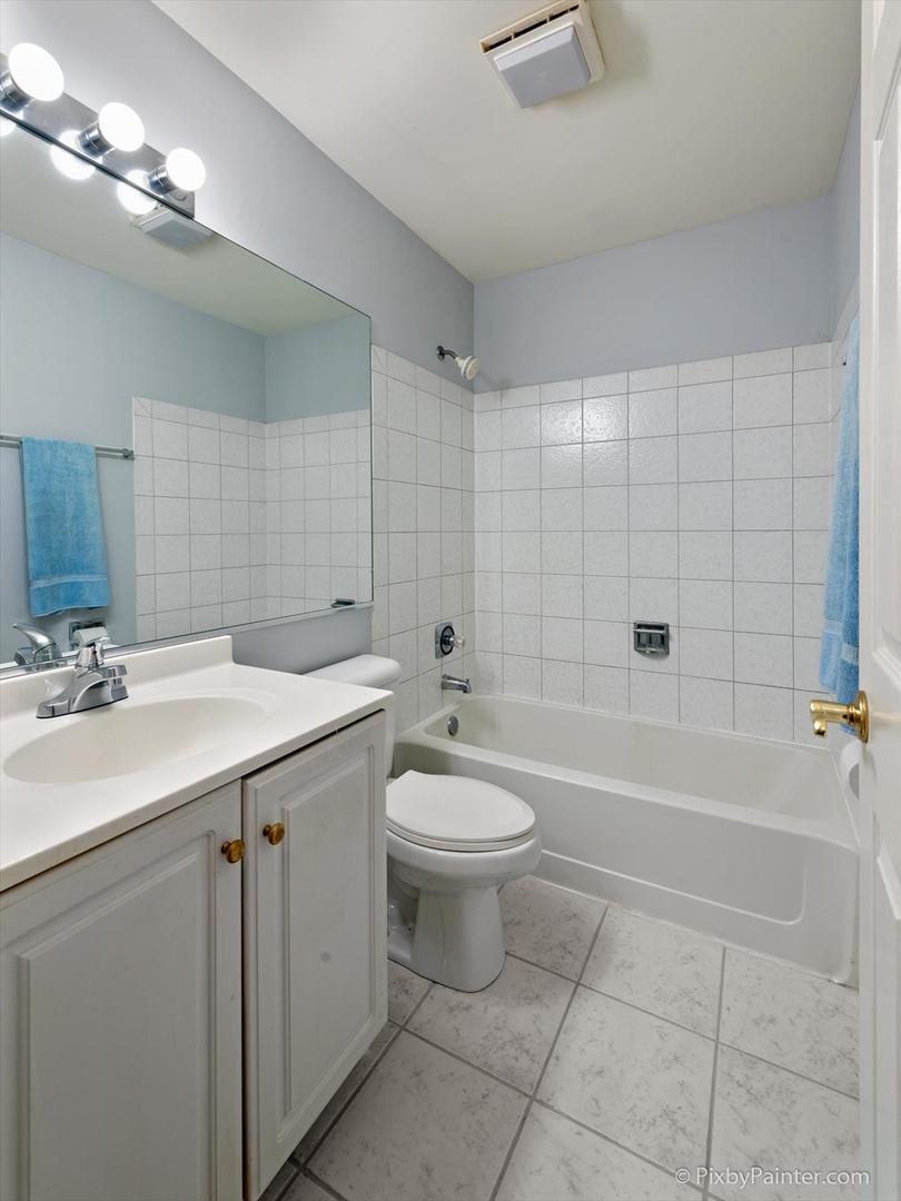 254 Charlotte Court Cary, IL 60013 - Photo 26 of 30 a bathroom with a sink a toilet and shower