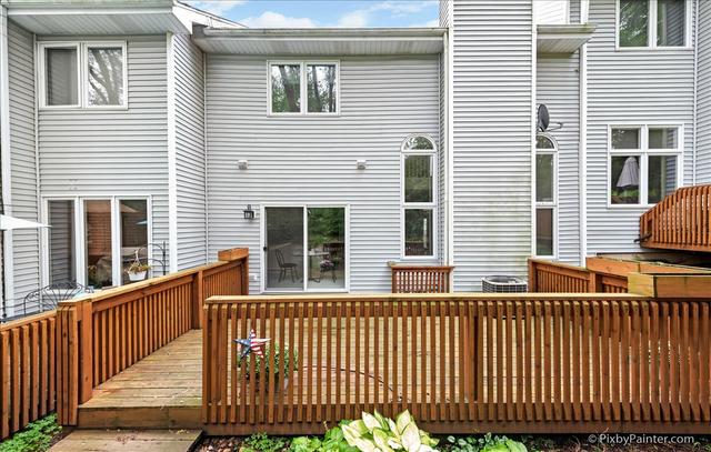 254 Charlotte Court Cary, IL 60013 - Photo 5 of 30 a front view of a house with a wooden fence