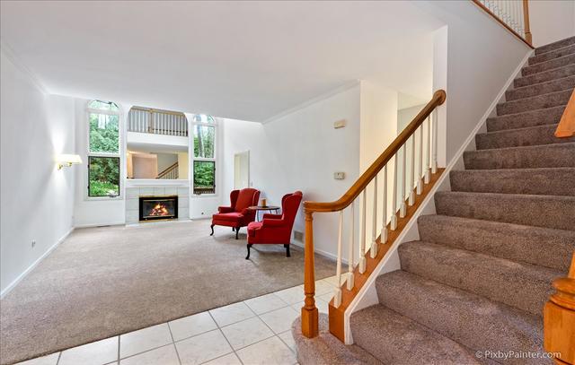 254 Charlotte Court Cary, IL 60013 - Photo 10 of 30 a view of entryway and hall with wooden floor