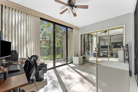 a room with gym equipment and a large window
