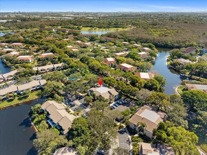 an aerial view of residential houses with outdoor space