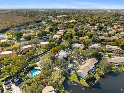 an aerial view of a houses with a yard