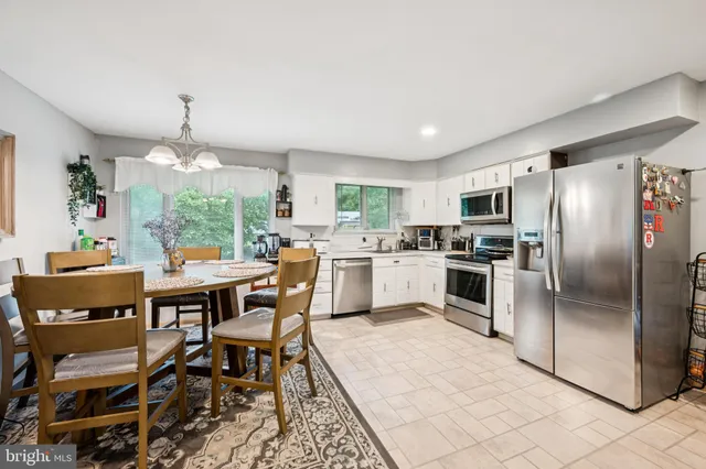 a kitchen with a stove microwave and cabinets