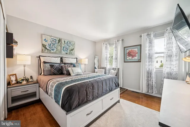 a bedroom with a bed and a mirror