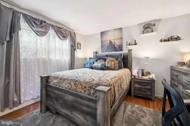 a bedroom with a bed and a cabinets