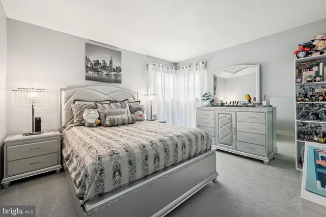 a bedroom with a bed and lamp