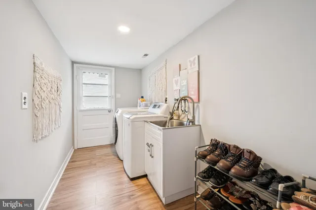 a bathroom with a granite countertop sink a toilet a mirror and shower