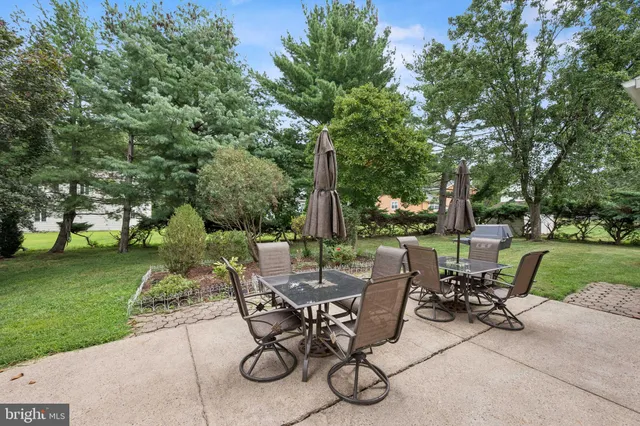 a view of a house with backyard porch and sitting area
