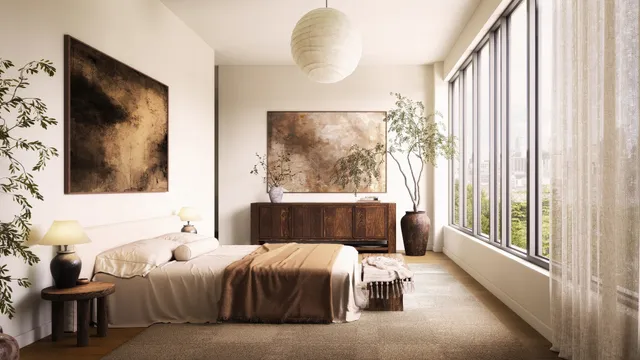 a bedroom with a bed and a painting on the wall