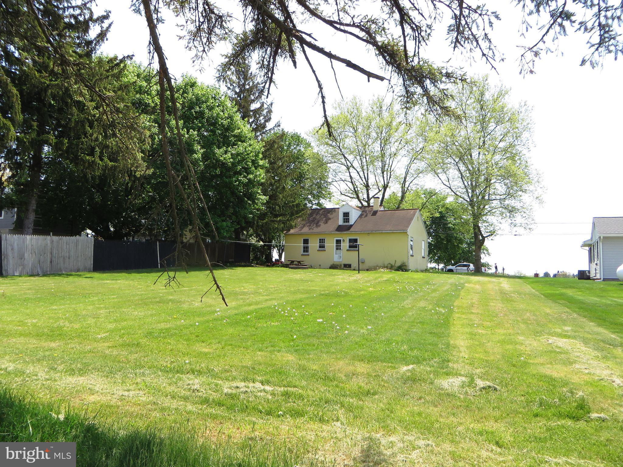 109 Chestnut Street Lititz, PA 17543 - Photo 4 of 15 a house with a big yard and large trees