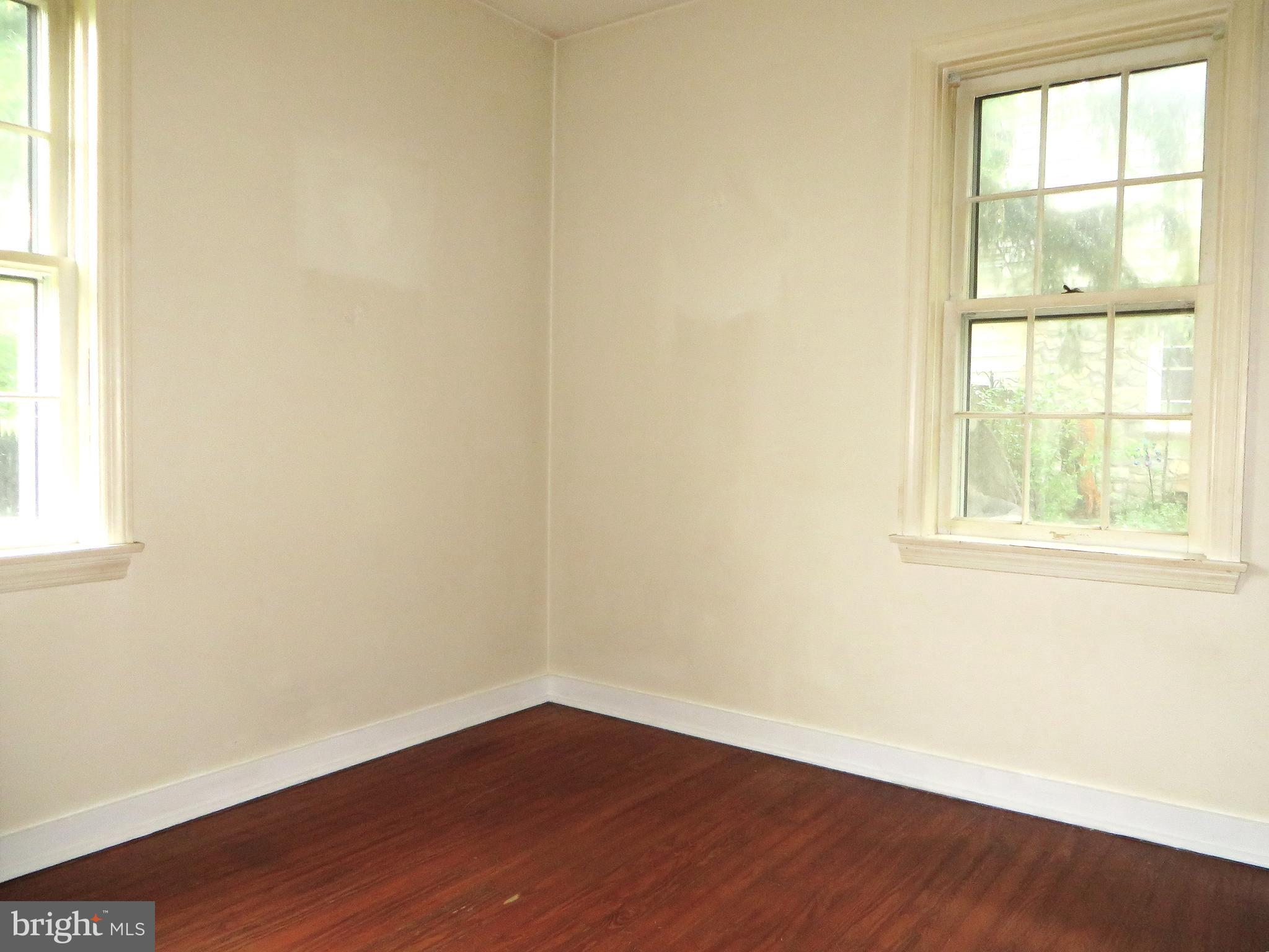 109 Chestnut Street Lititz, PA 17543 - Photo 9 of 15 an empty room with wooden floor and windows