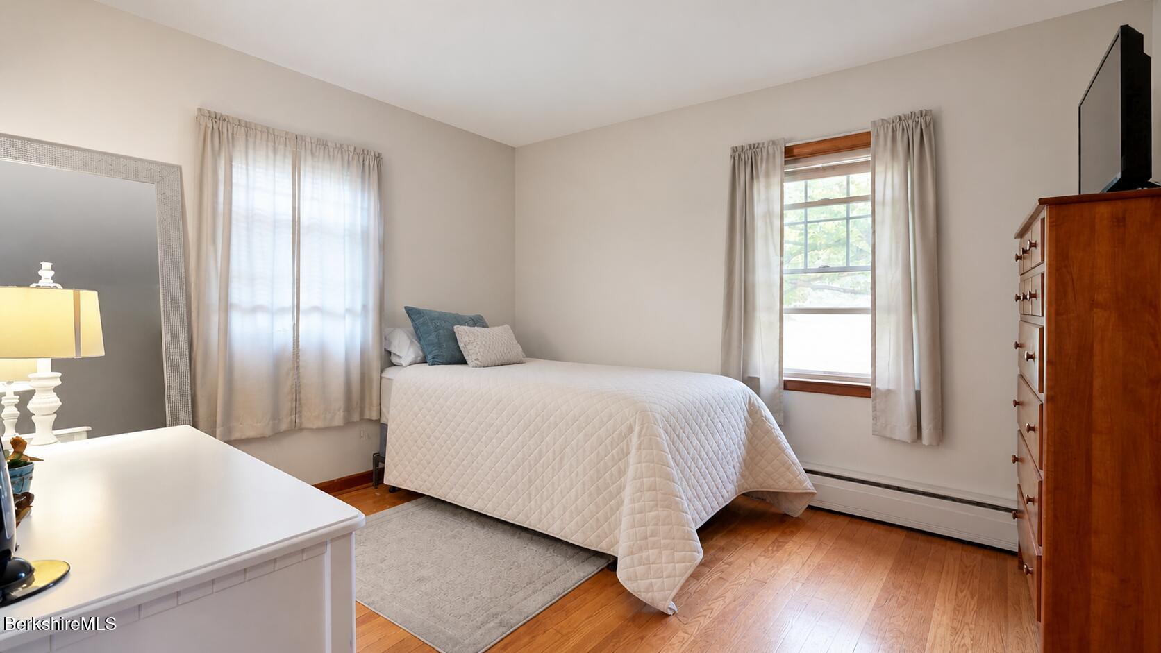 16 Anthony Street Adams, MA 01220 - Photo 13 of 33 a bedroom with a bed and a large mirror