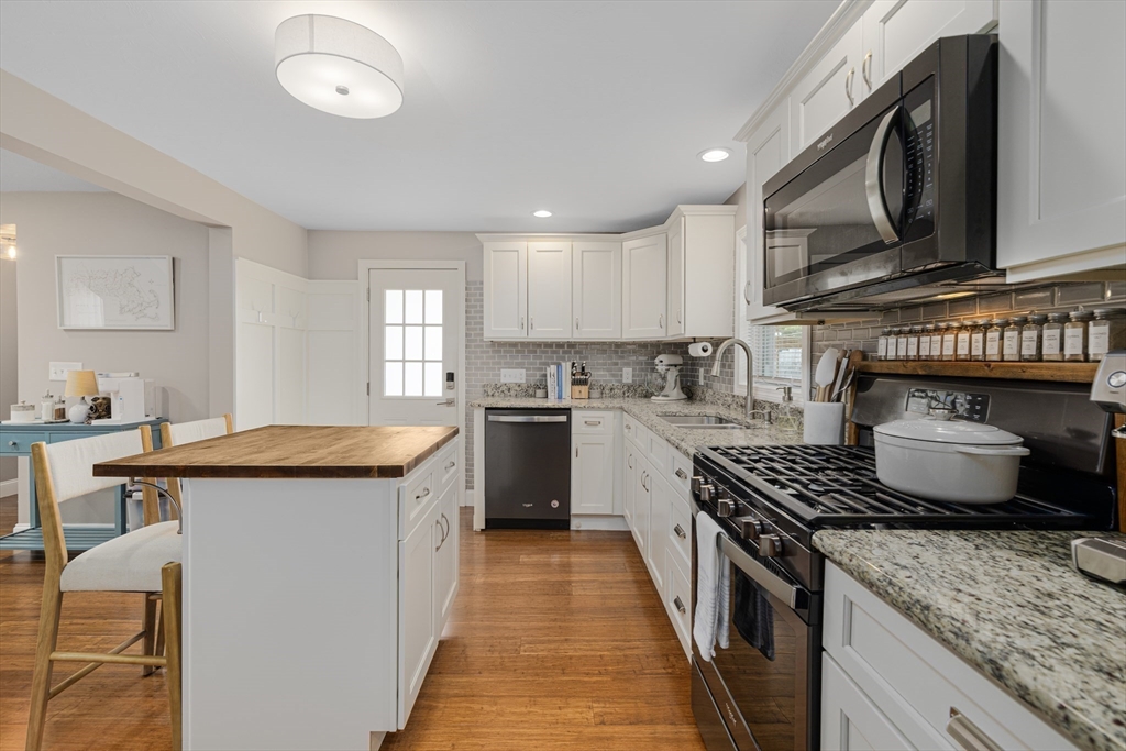 69 Denver Street Fall River, MA 02721 - Photo 15 of 35 a kitchen with granite countertop a sink and a stove