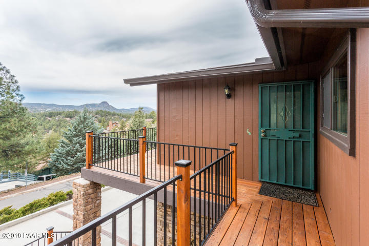 1251 Tanglewood Road Prescott, AZ 86303 - Photo 2 of 39 a view of balcony with wooden floor and fence
