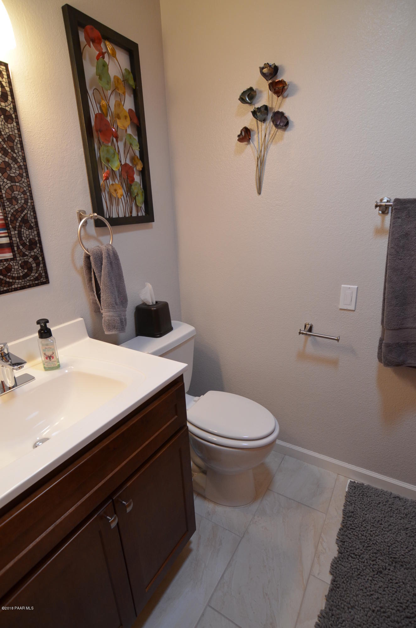 1251 Tanglewood Road Prescott, AZ 86303 - Photo 22 of 39 a bathroom with a toilet a sink and mirror