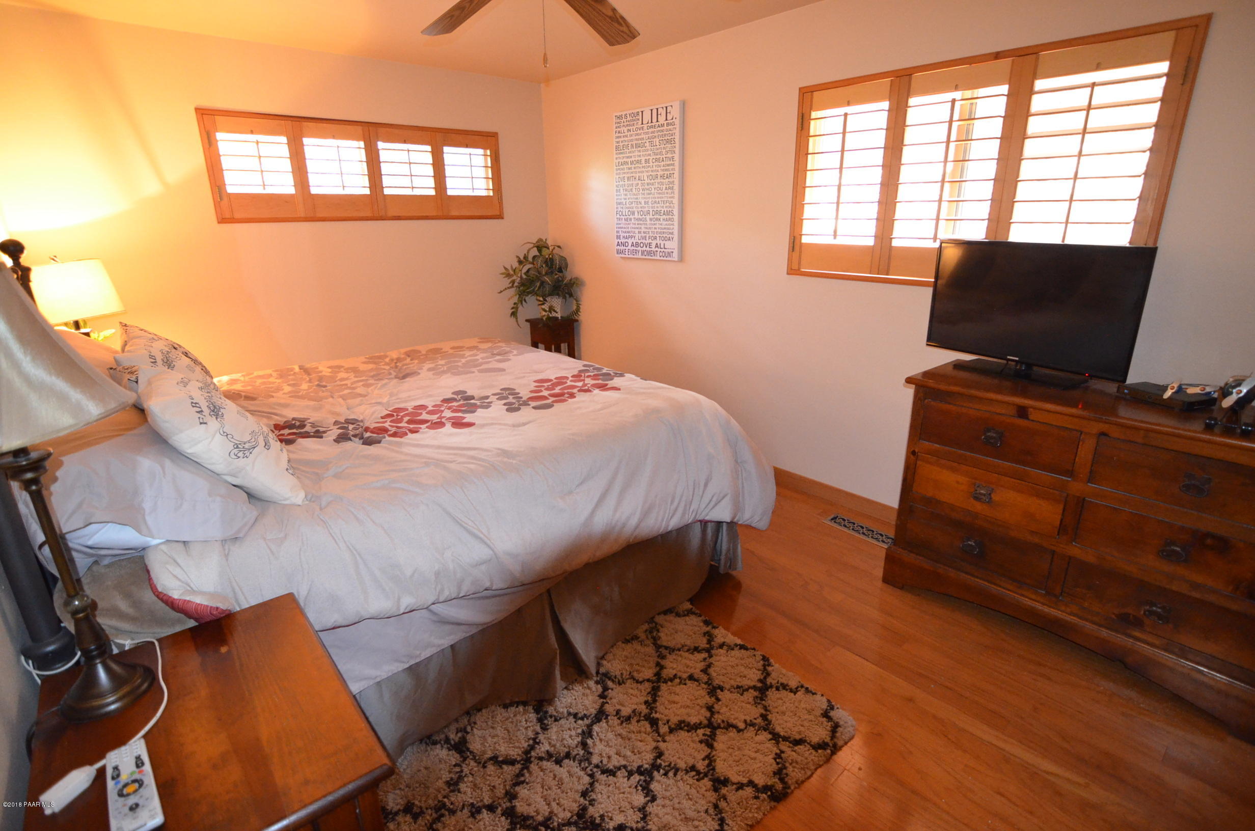 1251 Tanglewood Road Prescott, AZ 86303 - Photo 24 of 39 a bedroom with a bed and a tv