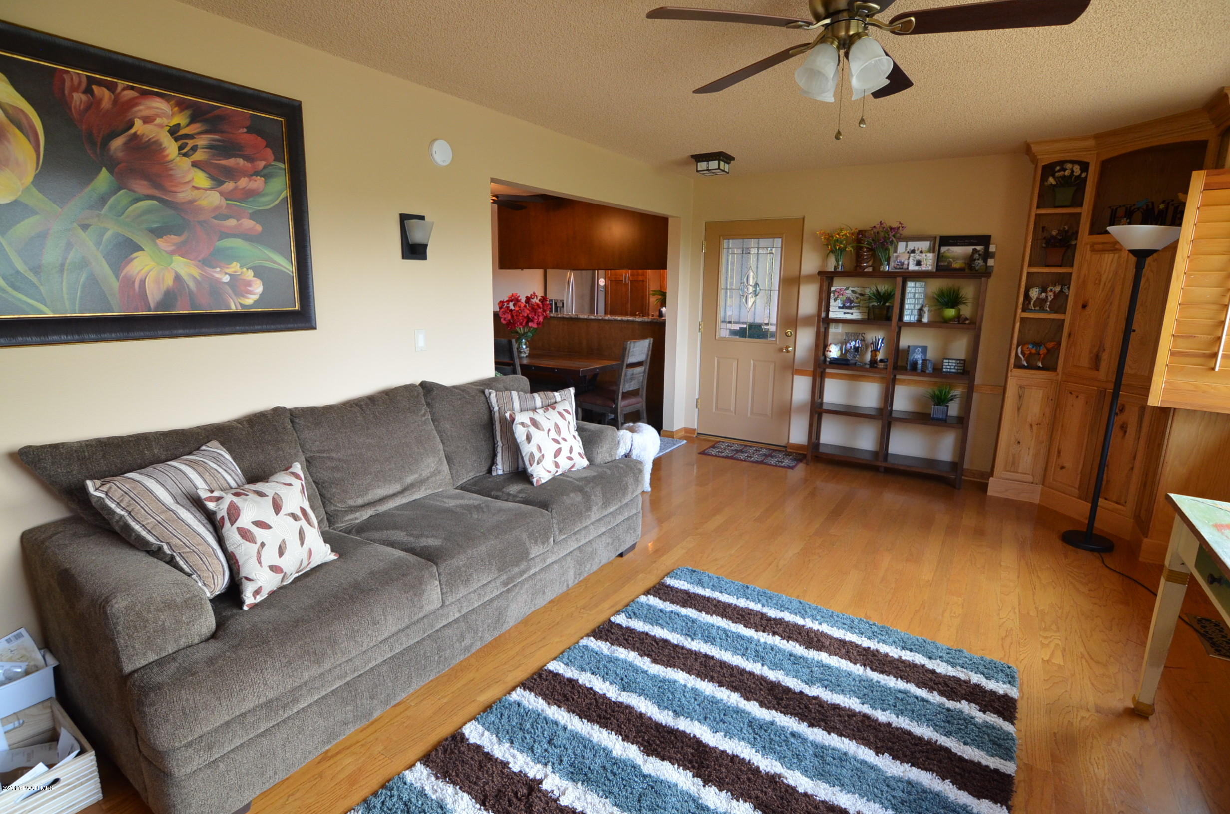 1251 Tanglewood Road Prescott, AZ 86303 - Photo 38 of 39 a living room with furniture and a flat screen tv