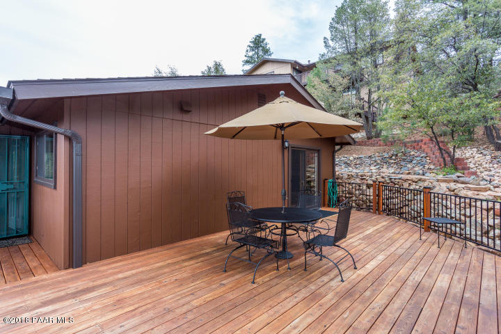 1251 Tanglewood Road Prescott, AZ 86303 - Photo 5 of 39 a view of a chairs and table on the wooden floor