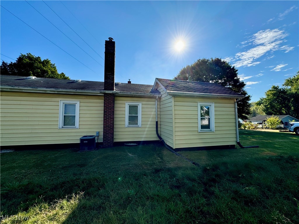 1325 Walnut Road Southeast Massillon, OH 44646 - Photo 3 of 34 Back of house with a yard