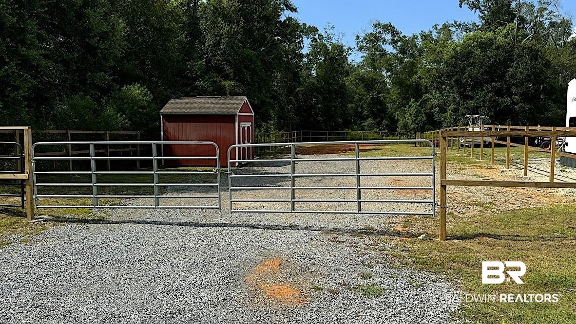 17885 Little Rock Road Foley, AL 36535 - Photo 1 of 5 Exterior space featuring a storage shed