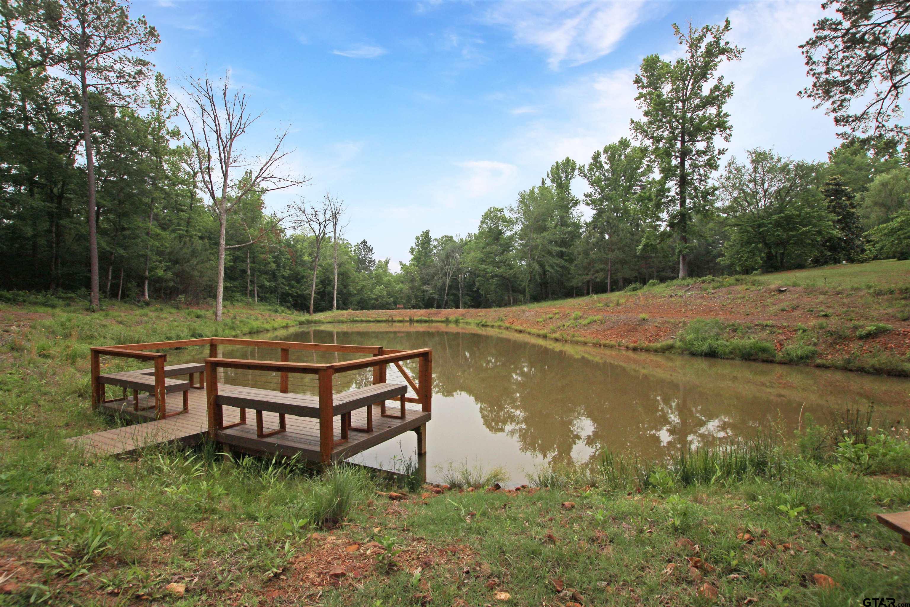 782 Rosie Wady Road Gladewater, TX 75647 - Photo 34 of 48 a view of a backyard with wooden fence