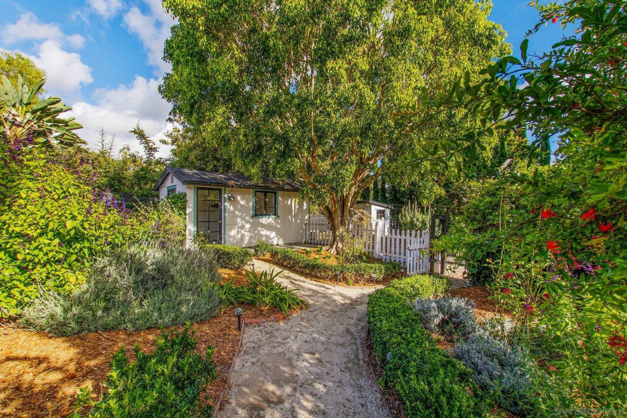 2335 Ivy Road Oceanside, CA 92054 - Photo 30 of 53 a view of a house with a small yard and tree s