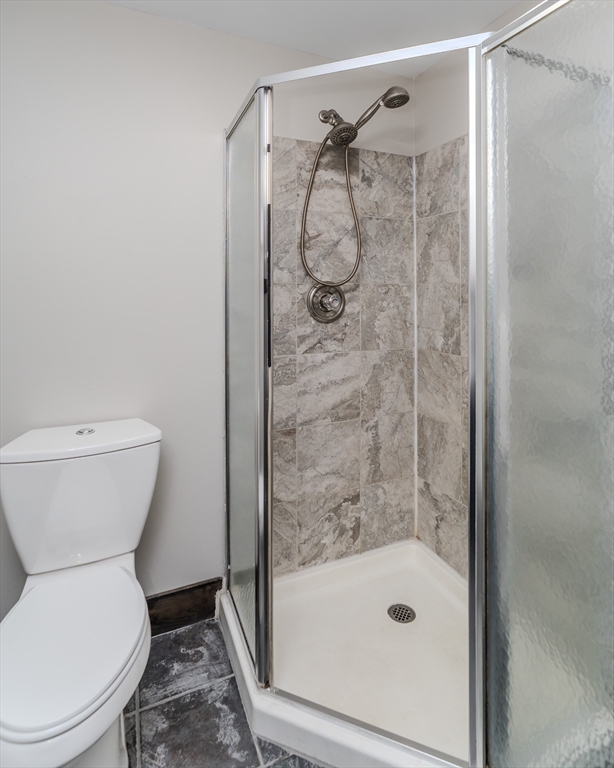 7 Webb Court Ware, MA 01082 - Photo 11 of 29 a bathroom with a shower and a toilet