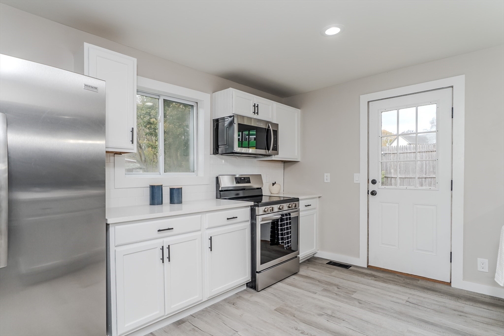 7 Webb Court Ware, MA 01082 - Photo 2 of 29 a kitchen with stainless steel appliances granite countertop a stove a sink and a refrigerator