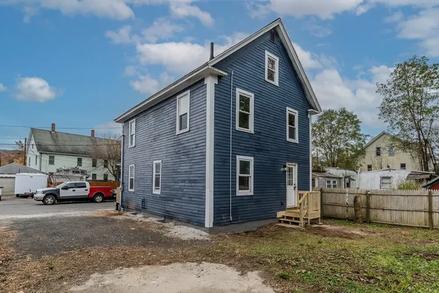 a view of a barn in a yard