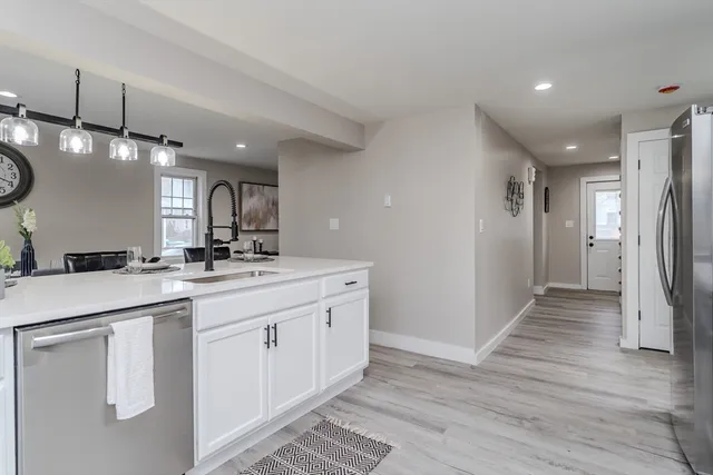 a bathroom with a sink a mirror and a shower
