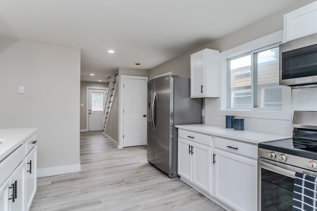 7 Webb Court Ware, MA 01082 - Photo 5 of 29 a kitchen with stainless steel appliances a refrigerator stove and sink