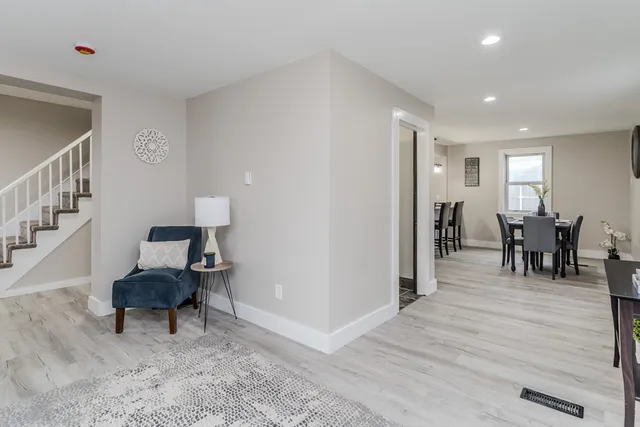 a living room with furniture and a chair