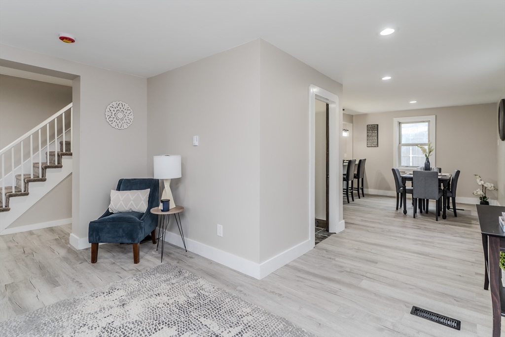 7 Webb Court Ware, MA 01082 - Photo 8 of 29 a living room with furniture and a chair