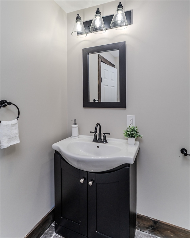 7 Webb Court Ware, MA 01082 - Photo 10 of 29 a bathroom with a sink and a mirror