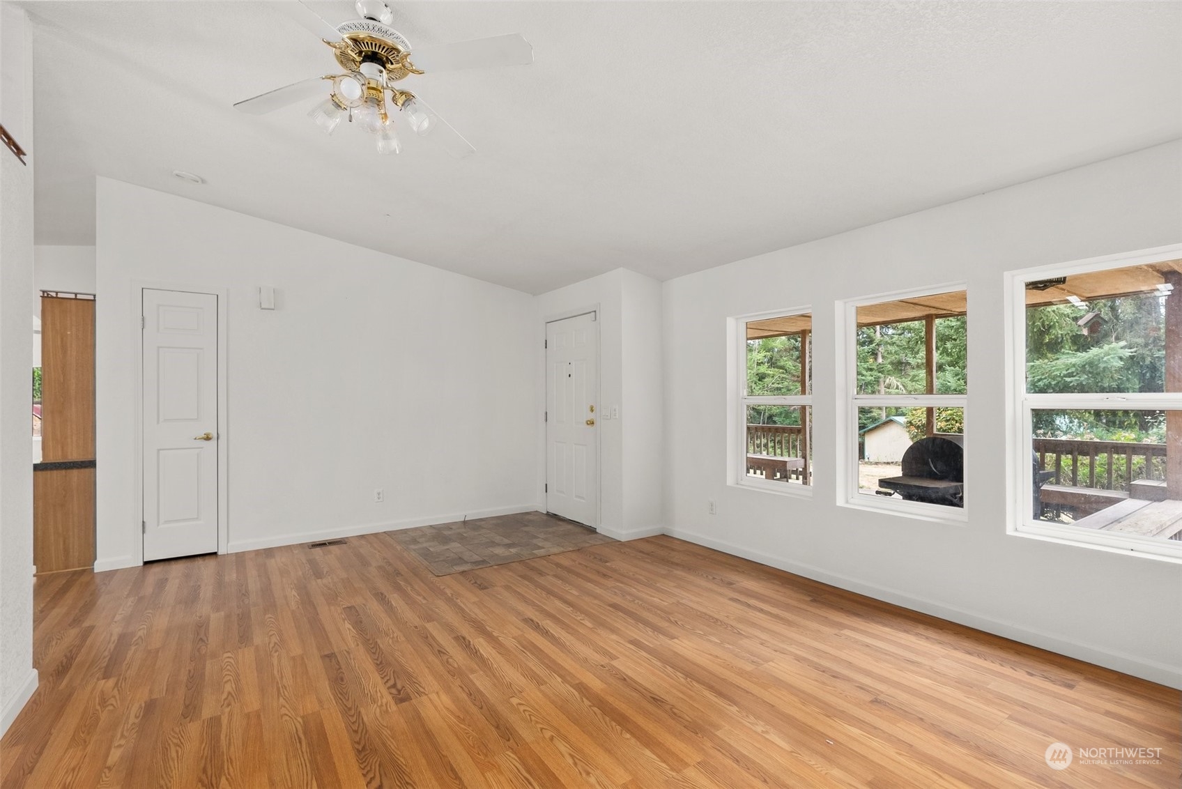 669 Twin Oaks Road Chehalis, WA 98532 - Photo 5 of 33 a view of empty room with wooden floor and fan